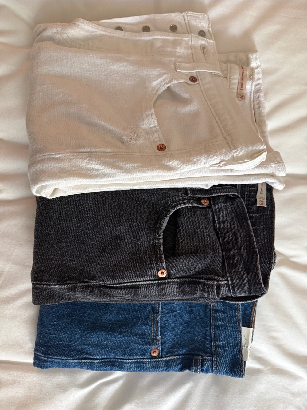Levi's White, Black, and Blue Denim Jeans